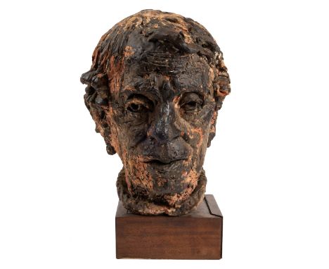 In the manner of Jacob Epstein A portrait head of a man, painted plaster mounted on a wooden plinth, with James Bourlet and S