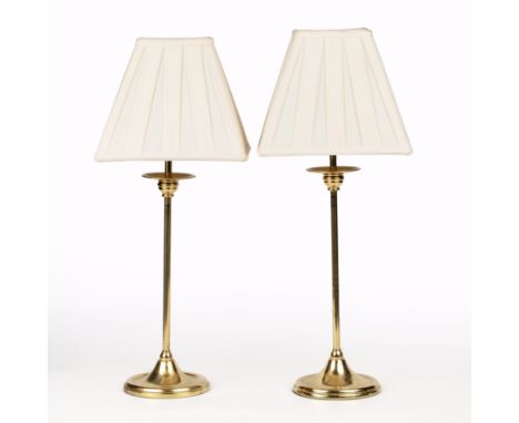 A pair of modern brass table lamps Each lamp with delicate stems and circular spreading bases.Each 40cm high to the fittingQt