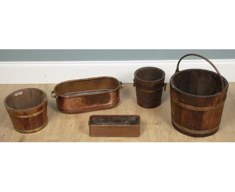 A collection of five planters and buckets A Lister &amp; Co antique coopered planter with copper banding and a handle; a Thom