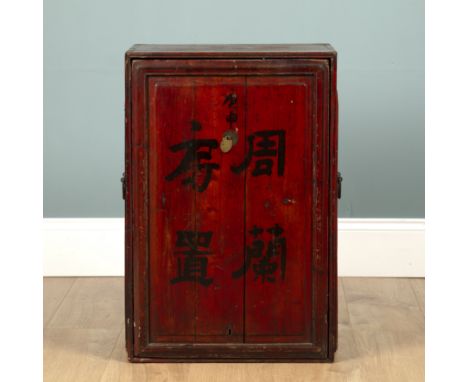 A Korean chest The panelled front painted with characters with side carrying handles.48cm wide x 72cm highQty: 1Wear commensu