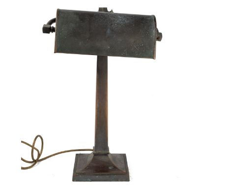 A brass desk lamp  With an adjustable shade, on a square support and a spreading plinth base.  44cm high.  Qty: 1  Notable ox