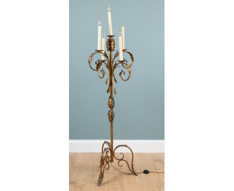 A four-branch gold-painted standard lamp The metal lamp with foliate decoration and on a triform base.171cm highQty: 1General