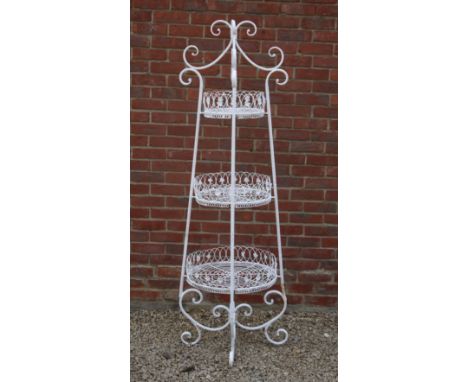 A three-tier white-painted wirework plant stand A three-tier white-painted wirework plant stand.62cm wide x 62cm deep x 148cm