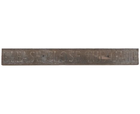A carved wood 'Please close the gate' sign The hardwood sign with traces of paint.81.5cm long x 10cm highQty: 1The carved let