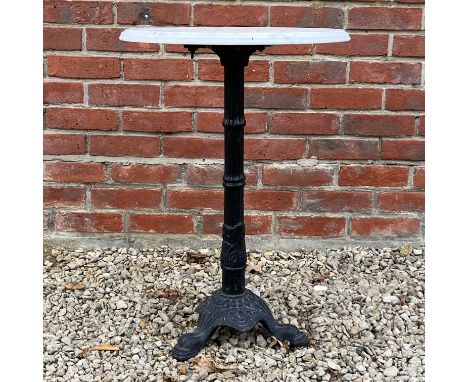A marble-topped occasional table With cast iron reeded support on a triform base.49cm x 72cmQty: 1Some light oxidisation and 