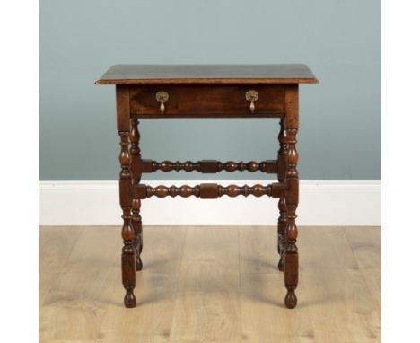 A William and Mary walnut side table With a frieze drawer and bobbin turned legs and stretcher.62cm wide x 48cm deep x 67cm h