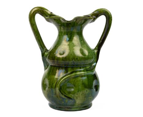 A Farnham Pottery green-glazed vase Of bulbous form with snake handles and twinned spouts to the rim.22cm highQty: 1A firing 