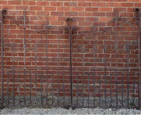 A pair of antique wrought iron entrance gates With scroll finials to the shaped gates.Each gate 110cm wide x 163cm highQty: 2