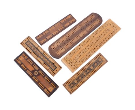 An Acme cribbage board, 33.5cm, 3 inlaid cribbage boards, and 2 Tunbridge Ware type crib boards 