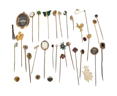 A collection of various unmarked gold and gilt-metal stickpins, including seed pearl and crescent design, a relief carved cam