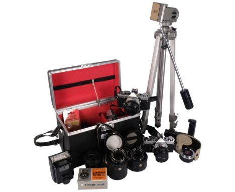 An Olympus OM-1N, and an Olympus OM-2N camera, with associated lenses, tripod and accessories, in a hardshell carry case 