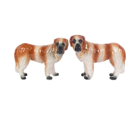 A pair of 19th century Staffordshire St Bernard dog figurines, H24cm (2)The first dog has a crack to the right front leg on t