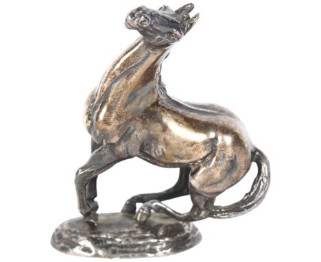 A cast solid silver model of a horse "playing up", by Lorne McKean, with hallmarks for John Pinches, 19.9oz, H10cm, fitted ca