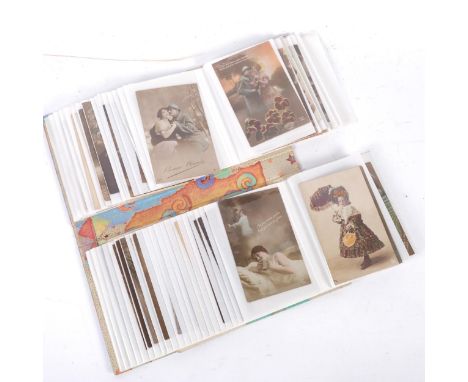 An album of early 20th century French postcards, including wartime, several First World War silks, etc 