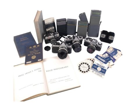 A quantity of Vintage cameras and equipment, including an Olympus OMG, and associated lens, a Nikon FM2, and associated Nikon