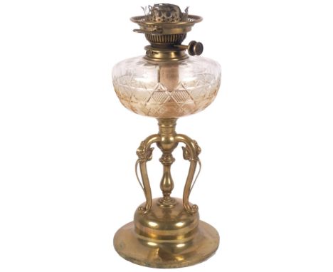 An Art Nouveau brass oil lamp with foliate decorated base, cut-glass font, with chimney, H60cm 