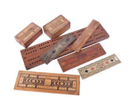 A group of 7 Vintage cribbage boards, largest 46cm long, including 2 boxes with playing cards 