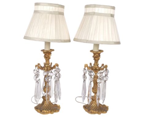 A pair of gilt brass table lamp, with glass lustres and pleated shades, overall height 47cmBoth in good condition, will need 