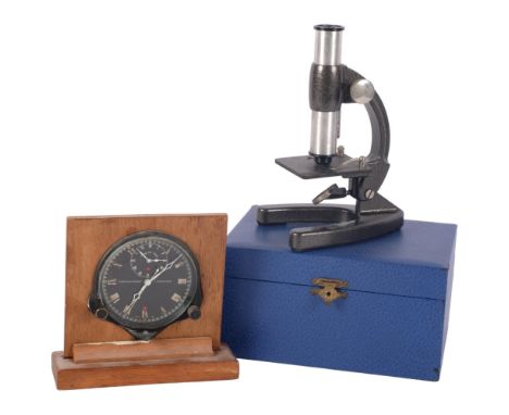 Vintage Smiths car clock on wooden stand, and a small cased microscope 