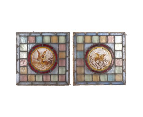A pair of Victorian stained leadlight glass panels, with central hand painted bird decoration, 33.5cm x 33.5cm&nbsp;Both are 