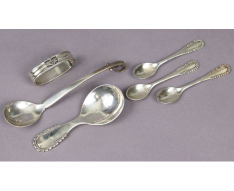 A Georg Jensen sterling “Viking” pattern caddy spoon; three ditto coffee spoons (London import marks for 1928); a Georg Jense