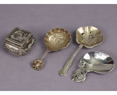An Arts &amp; Crafts planished silver caddy spoon with oval bowl &amp; off-set pierced floral handle, Birmingham 1928 by Bern
