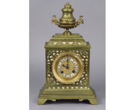 A late 19th/early 20th century continental mantel clock in pierced brass architectural case, the 3” engine-turned dial inset 