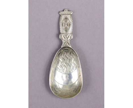 A Liberty &amp; Co. silver caddy spoon designed by Bernard Cuzner, the flat handle &amp; elongated oval bowl with geometric d
