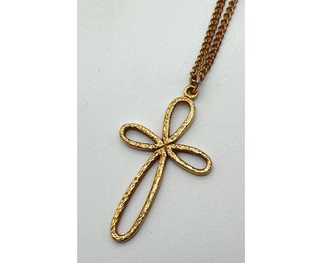 A large 9ct gold looped cross pendant and chain. A 4cm drop pendant, fully hallmarked and with makers mark, on a 14" chain wi