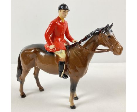 A Beswick ceramic Huntsman and horse figurine #1501, in brown gloss. Issued from 1957 - 95 and modelled by Arthur Gredington.