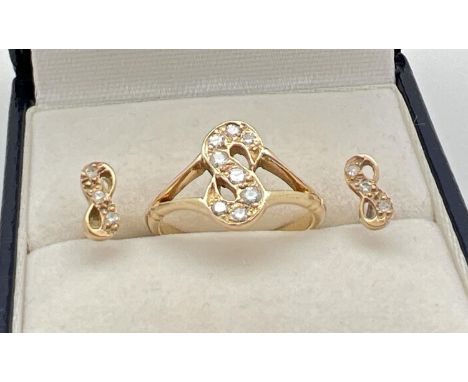 A 14ct yellow gold ring set with 8 diamonds in the shape of the letter 'S'. Together with a pair of matching stud earrings, e