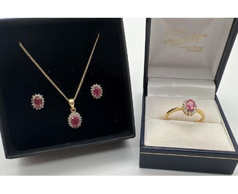 A ruby and diamond silver gilt stud style earrings, pendant necklace and dress ring matching set. Each item set with an oval 