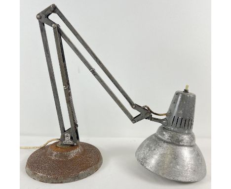 A vintage angle poise lamp with various markings. Stand Marked "Norway" and sticker for "1001 Lamps". Top of stand marked "US