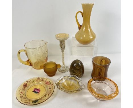 A collection of vintage and art glass items in amber and brown tones. To include: twist stemmed candle stick, egg shaped pape