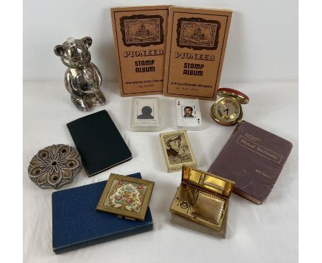 A collection of vintage misc items. To include: Pioneer stamp albums, Melissa musical compact, playing cards, Europa travelli