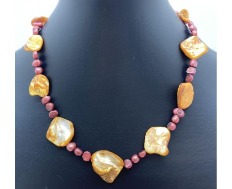 A 16" dyed freshwater pearl and shell beaded necklace with white metal T bar clasp. Retired jewellery makers stock. 