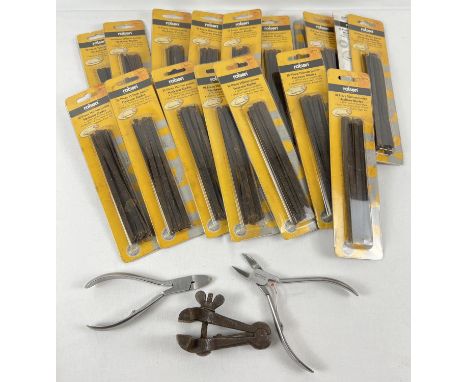 A collection of 18 packets of unopened Rolson 150mm junior hacksaw blades together with a small clamp and two pairs of wire c