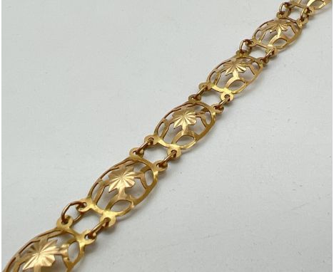 A vintage 9ct gold bracelet with 8 decorative pierced work panels and spring clasp. Total length approx. 7 inches. Marked 9ct