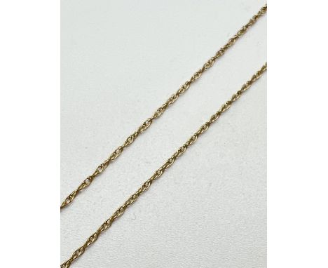 A 16" 9ct yellow gold fine rope chain with spring ring clasp. Stamped 9k to clasp. Total weight approx. 0.7g. 