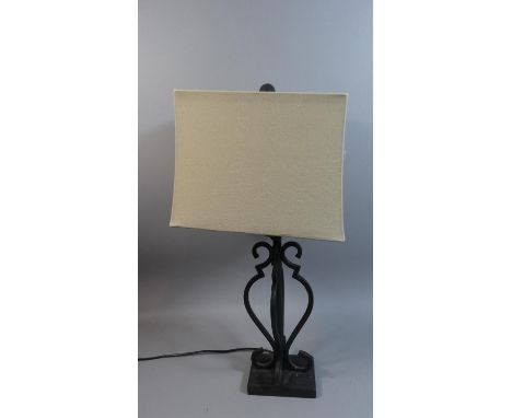 A Wrought Iron Table Lamp and Shade 