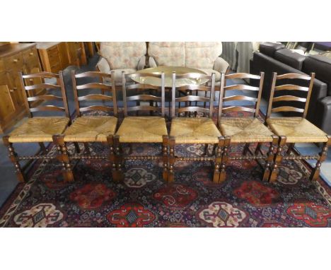 A Set of Six Rush Seated Ladder Back Dining Chairs 