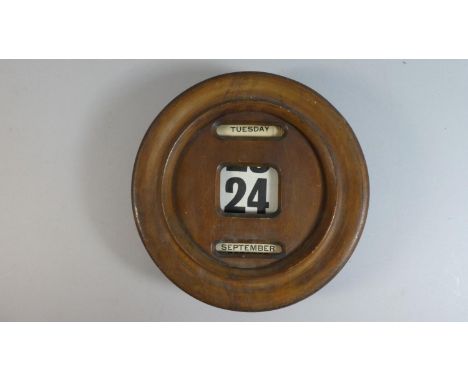 An Edwardian Circular Wall Hanging Desk Calendar with Day, Date and Month, 26cm Diameter 