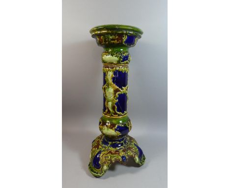 A Tripod Majolica Jardiniere Stand, Stapled Repair to Tripod Base and Cracked Body, 73cm High 