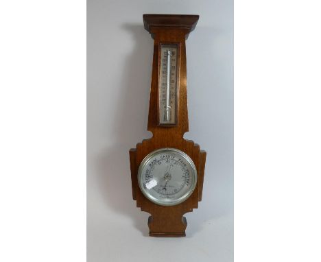 A Mid 20th Century Wall Hanging Aneroid Barometer with Temperature Scale. 47cm high 