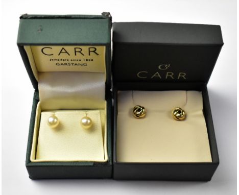 Two pairs of 9ct gold earrings to include a pair of rosette studs and a pair of cultured pearl studs.