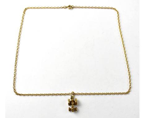 A 9ct gold pendant in the form of a vintage tractor, the hallmark concealed where the tractor side grille would be, with neck