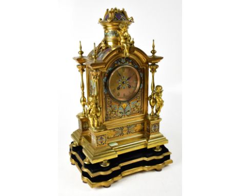 JAPY FRÈRES; a 19th century French champlevé enamelled gilt, brass mantel clock, the gilt dial set with Roman numerals and fl