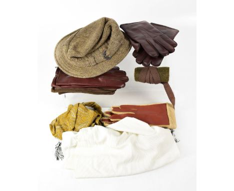 A gentlemen's collection of various vintage textiles to include a black velvet bow tie, various gloves, a yellow silk paisley