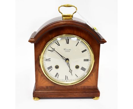 FRANZ HERMLE; a Comitti of London mahogany cased chiming mantel clock, the circular white enamelled dial set with Roman numer