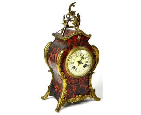 A boule mantel clock with an ivorine dial set with Roman and Arabic numerals, movement striking on bell stamped 'BG', case wi